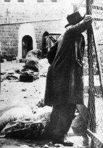 A survivor mourning in the aftermath of the massacre in Hebron.